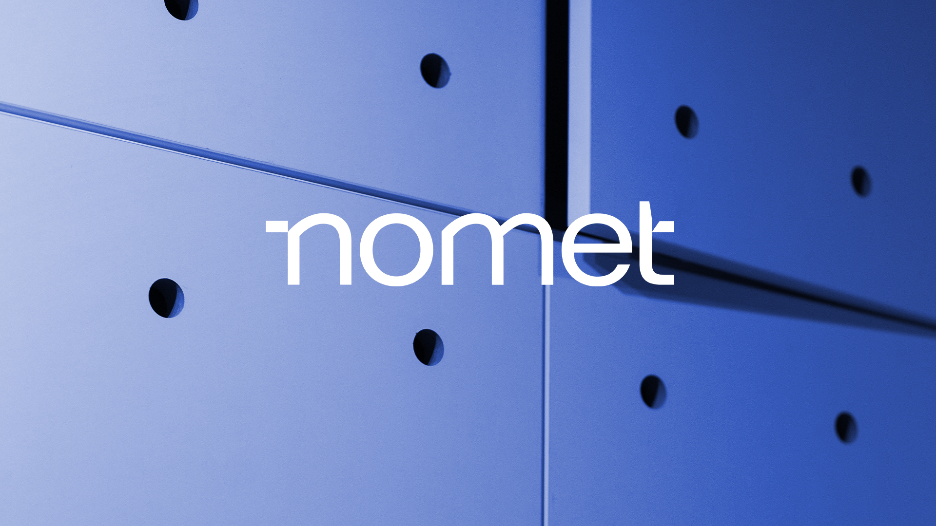 nomet. brand logo on a blue cabinet background